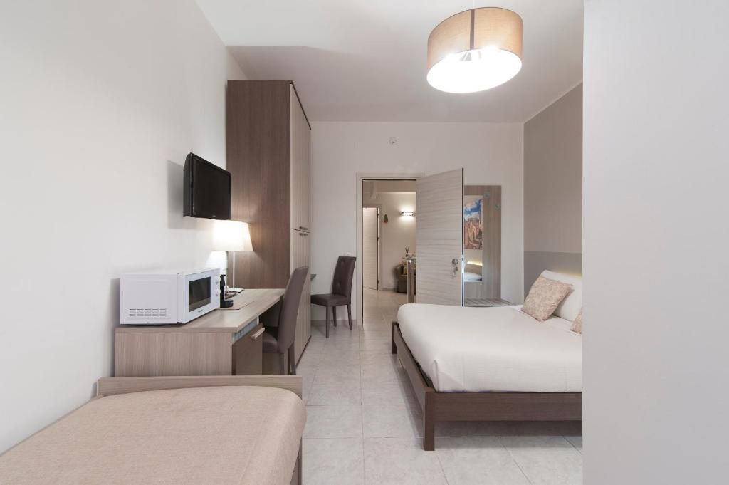 A bed or beds in a room at B&B Kalurya - Lecce Selection