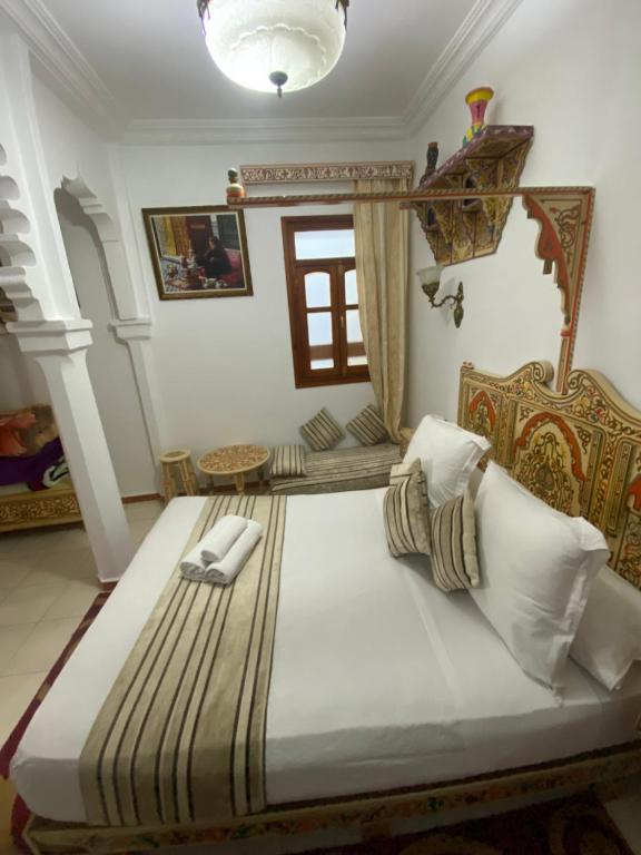 Postel nebo postele na pokoji v ubytování Hotel Casa Khaldi