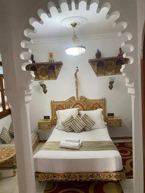 Postel nebo postele na pokoji v ubytování Hotel Casa Khaldi