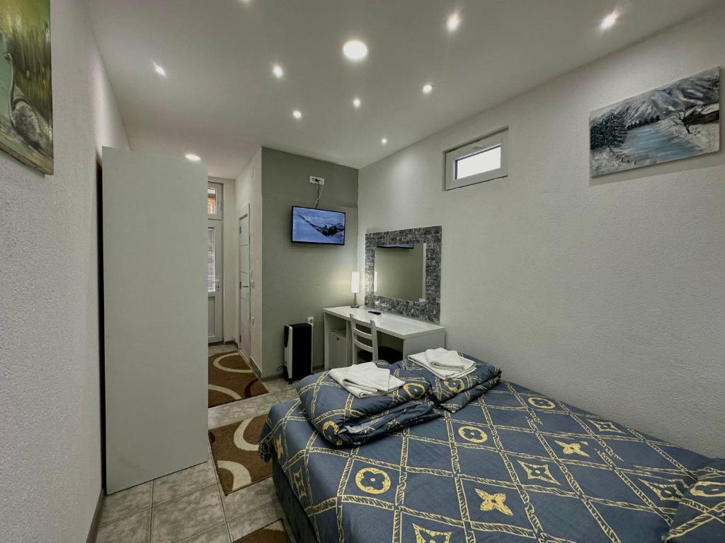 Postel nebo postele na pokoji v ubytování Vila Veljković - Sobe & apartmani " Ljupče "