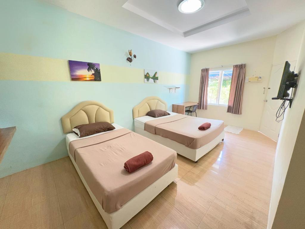 Postel nebo postele na pokoji v ubytování Krabi Ava Hill