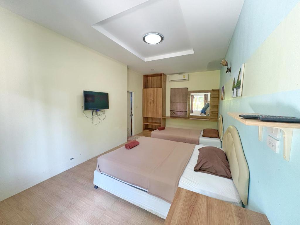 Postel nebo postele na pokoji v ubytování Krabi Ava Hill