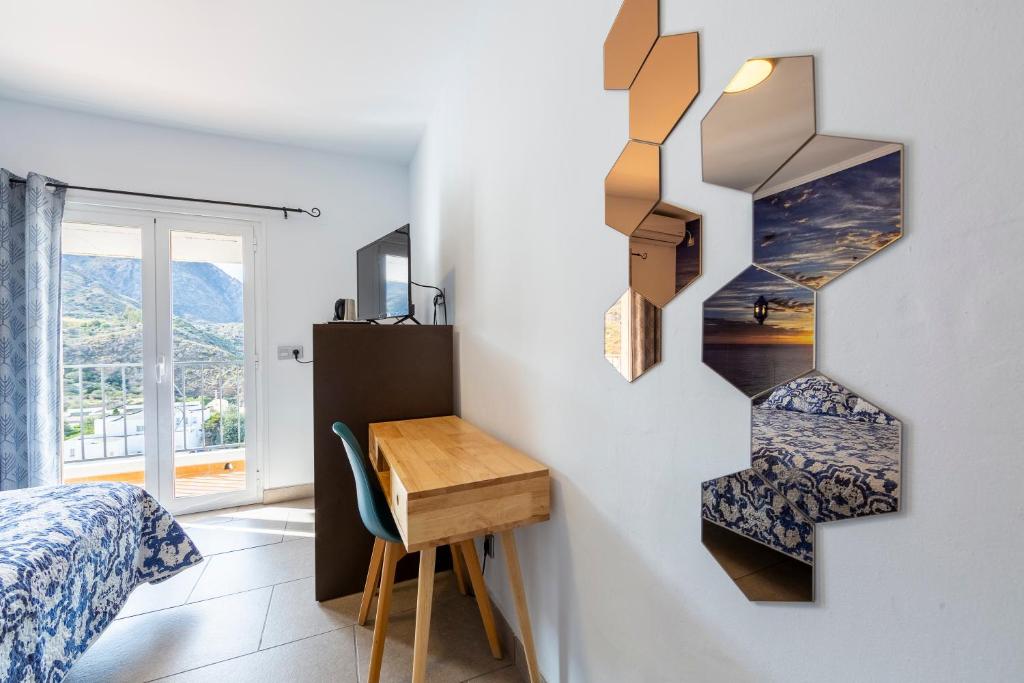 TV a/nebo společenská místnost v ubytování Boutique Hotel El Olivar
