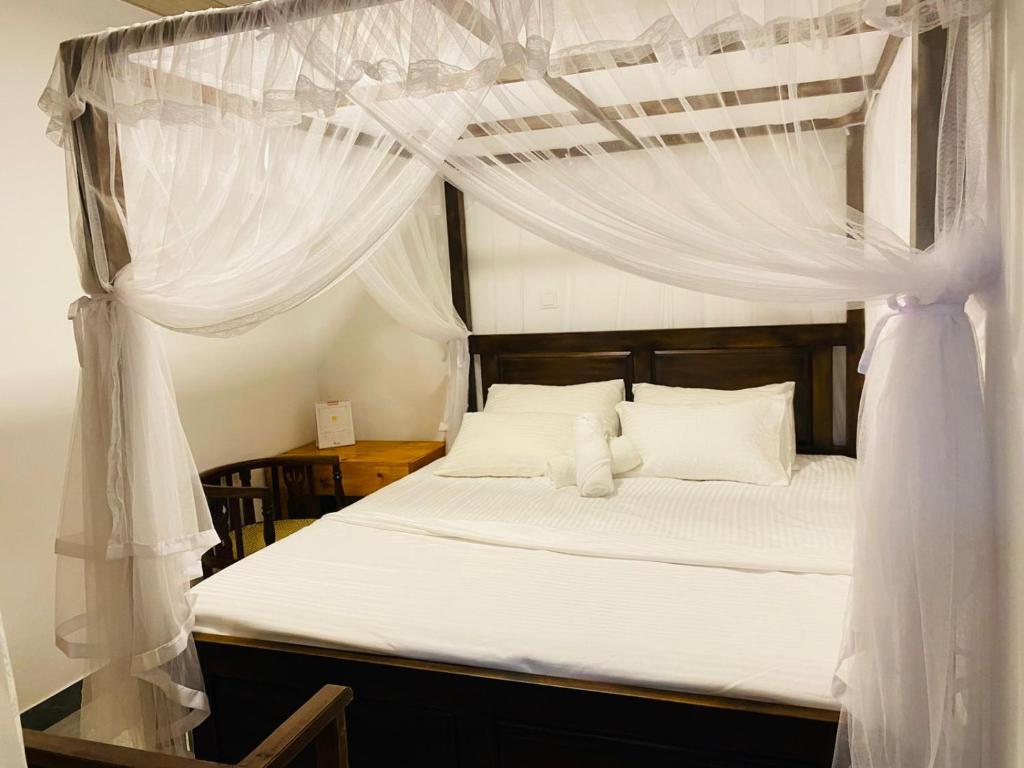 Ένα ή περισσότερα κρεβάτια σε δωμάτιο στο Tropical Room light