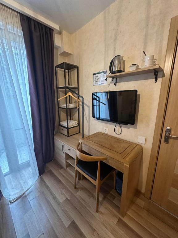 TV a/nebo společenská místnost v ubytování Hotel cozy jano