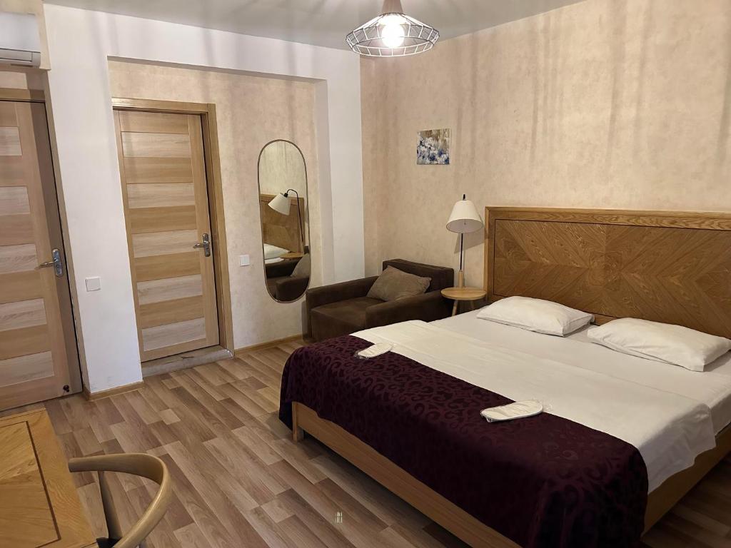 Postel nebo postele na pokoji v ubytování Hotel cozy jano