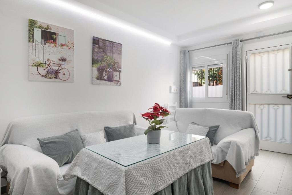 a living room with a table and a couch at La Payana, Sierra de Grazalema Consultar precios en LA PAYANA Prado del Rey in Prado del Rey