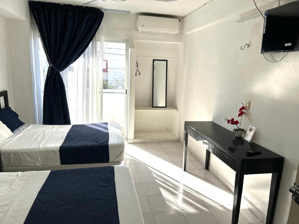 Postel nebo postele na pokoji v ubytování Hotel Independencia