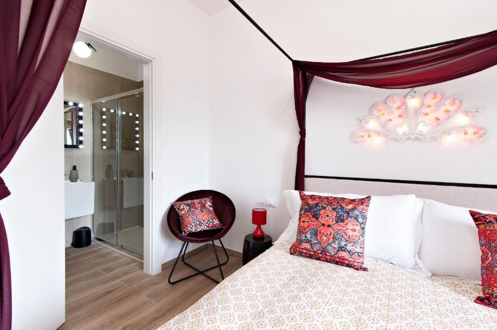 Postel nebo postele na pokoji v ubytování 7Rooms - Lecce Selection