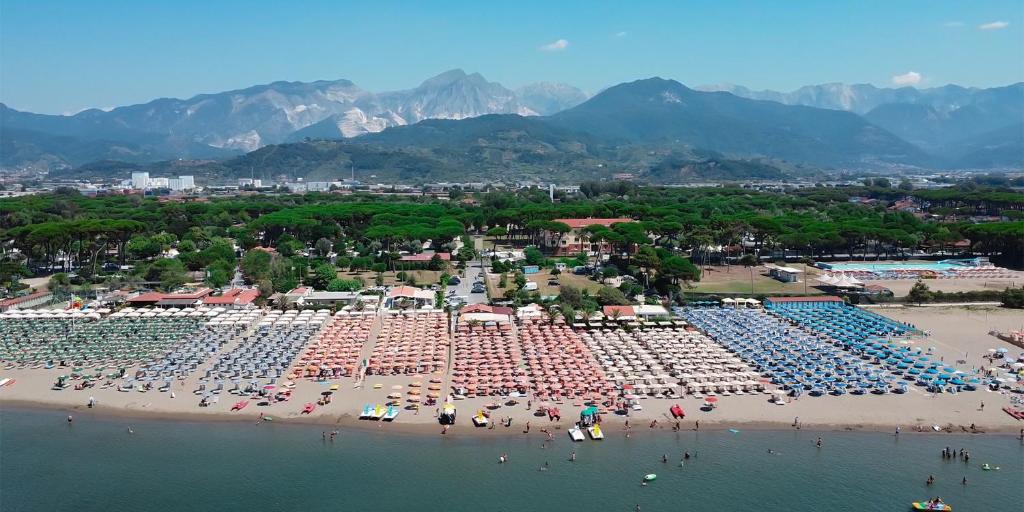 an aerial view of a beach with a large pool at Massa Marina Camping in Marina di Massa