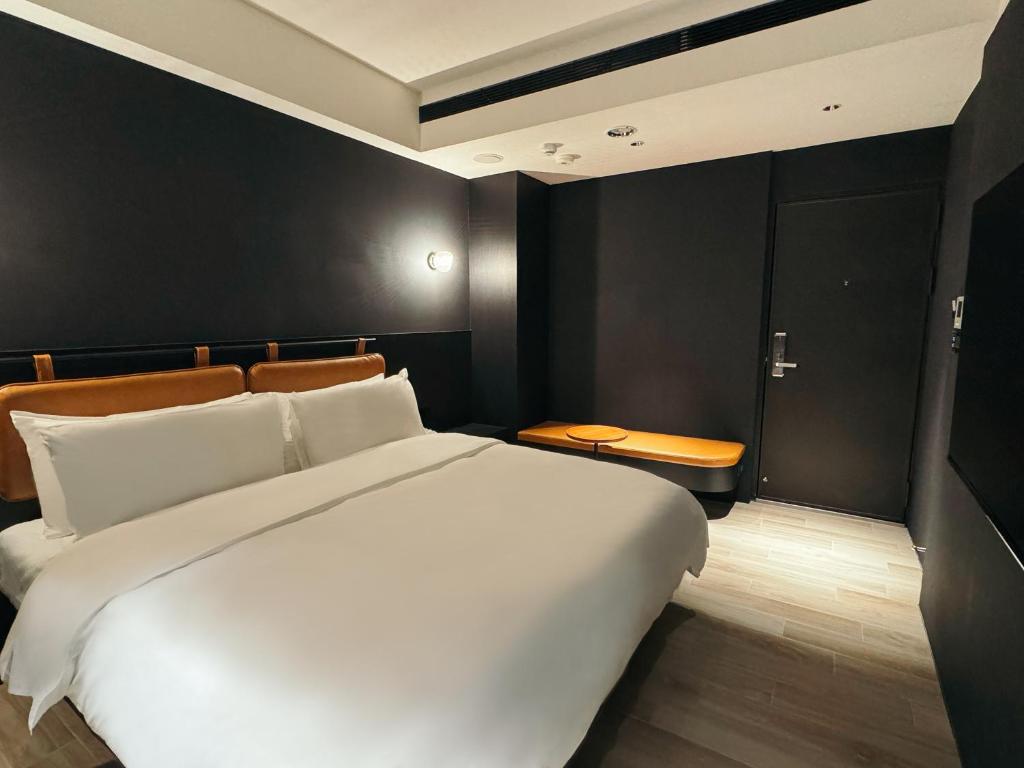 Postel nebo postele na pokoji v ubytování Hope Hotel Tainan - Kangle Branch