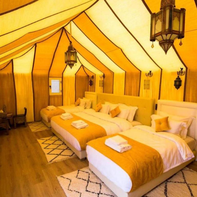 Postel nebo postele na pokoji v ubytování Luxury Trippers Camp