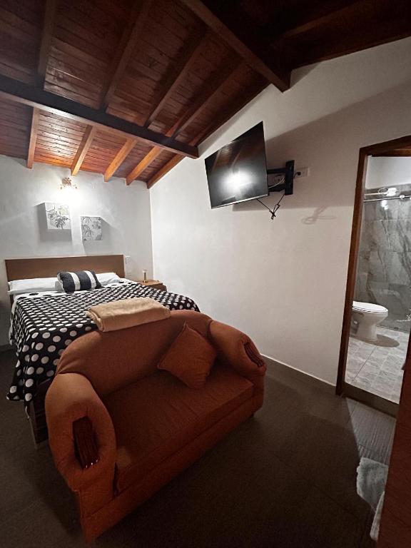 Postel nebo postele na pokoji v ubytování Hotel Olímpica