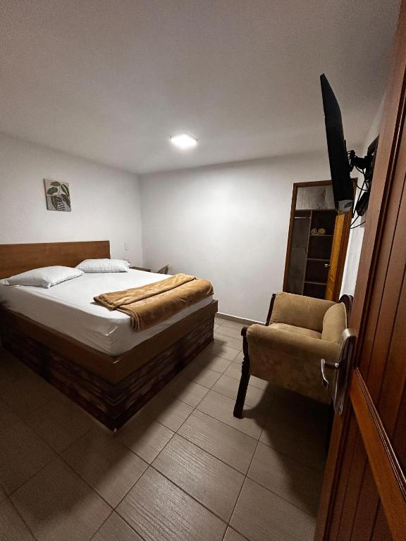 Postel nebo postele na pokoji v ubytování Hotel Olímpica
