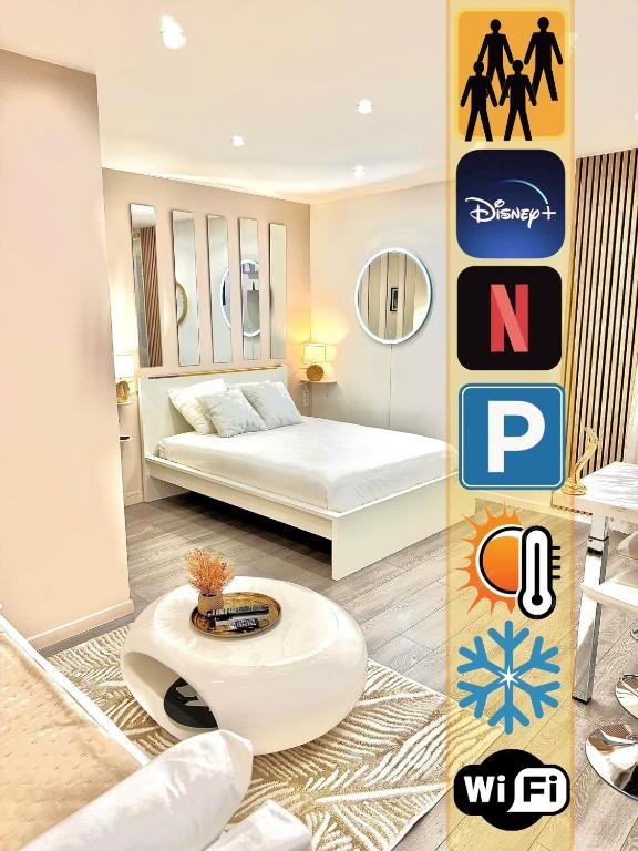 une chambre d'hôtel avec un lit et une table dans l'établissement Suites DUBAI chambre privée avec espaces communs, à Perpignan