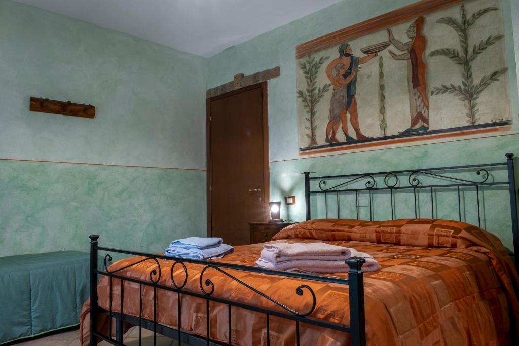 Postel nebo postele na pokoji v ubytování Bio Agriturismo Aia del Tufo