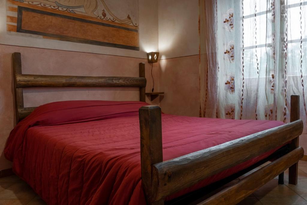 Postel nebo postele na pokoji v ubytování Bio Agriturismo Aia del Tufo