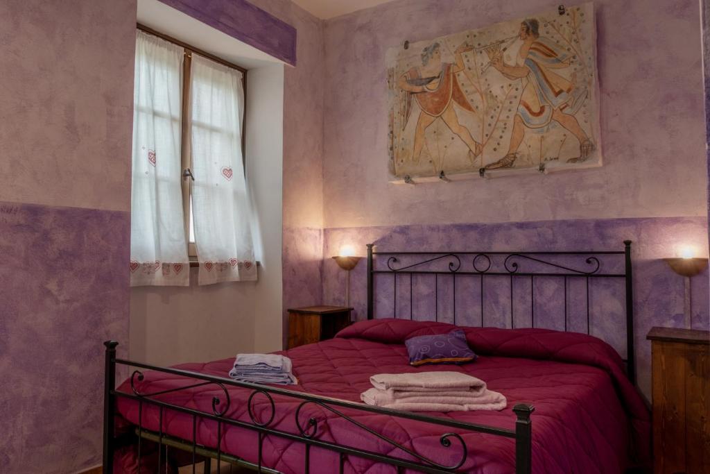 Postel nebo postele na pokoji v ubytování Bio Agriturismo Aia del Tufo