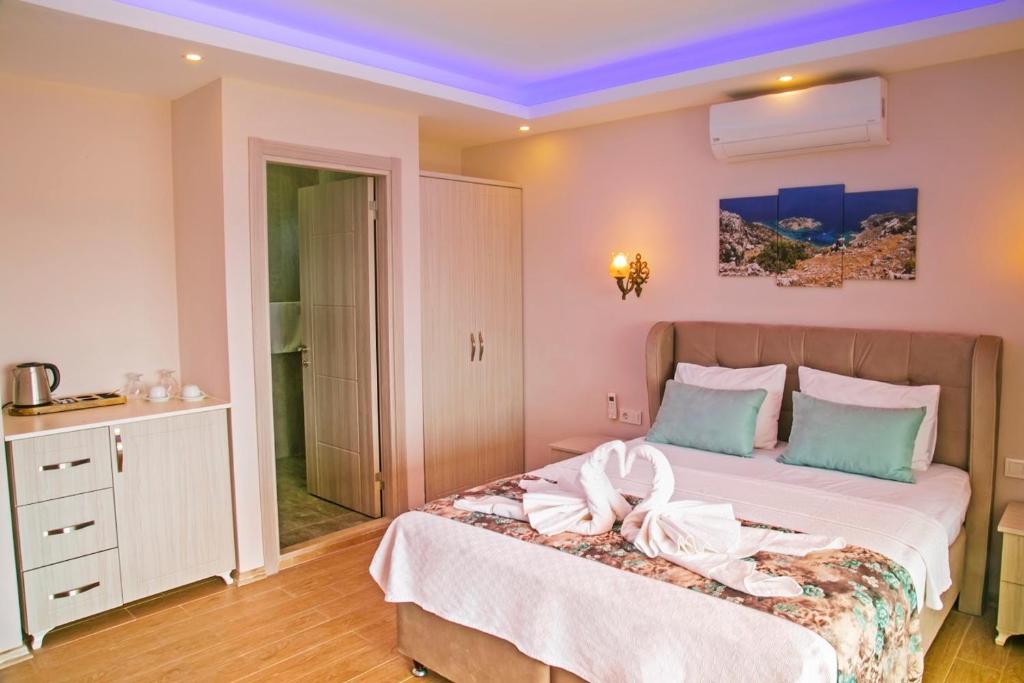 Postel nebo postele na pokoji v ubytování Suna House