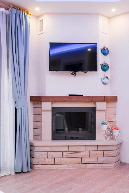 TV a/nebo společenská místnost v ubytování Suna House