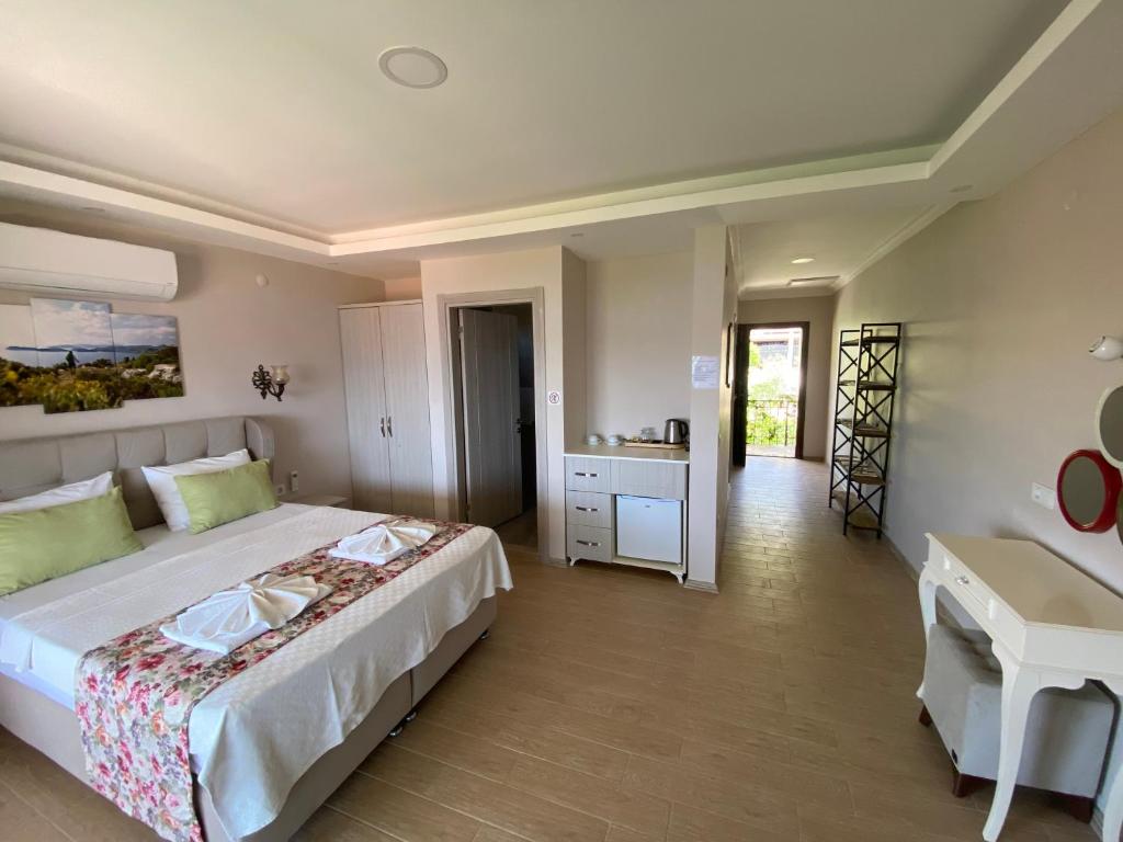 Postel nebo postele na pokoji v ubytování Suna House