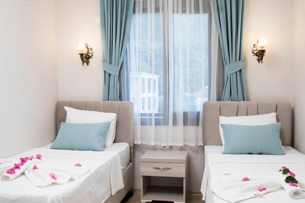 Postel nebo postele na pokoji v ubytování Suna House