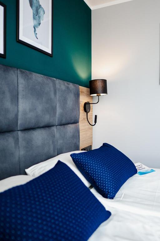 Postel nebo postele na pokoji v ubytování Hotel Kyriad Stargard
