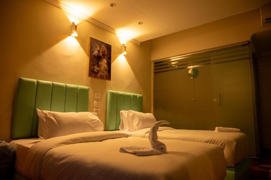 Postel nebo postele na pokoji v ubytování Soft Hotel