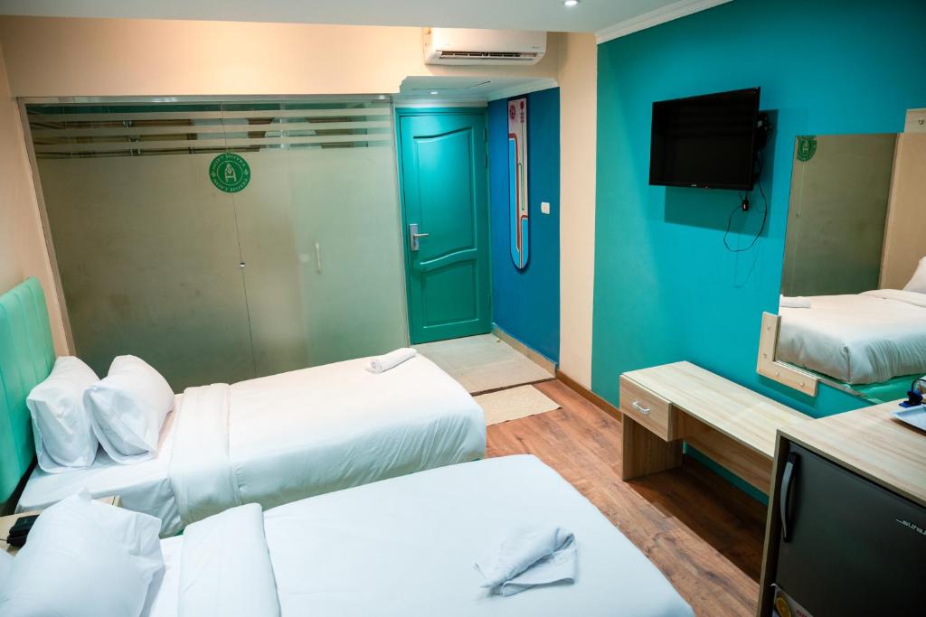 Postel nebo postele na pokoji v ubytování Soft Hotel