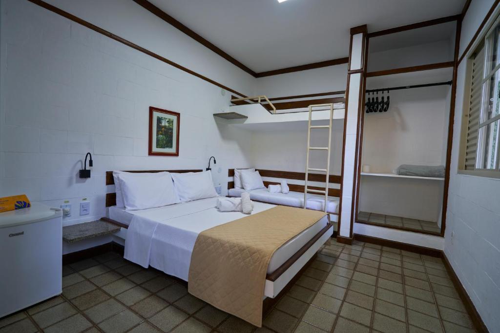 a bedroom with a bed and a ladder in it at Sesc Venda Nova in Belo Horizonte