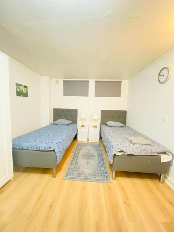 Postel nebo postele na pokoji v ubytování Noah Longstay daggstigen 22