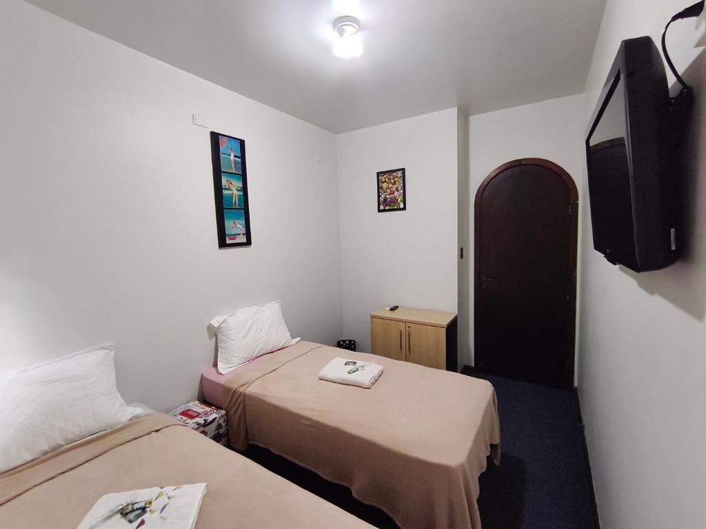 Postel nebo postele na pokoji v ubytování Quarto FIRST CLASS econômico DUPLO