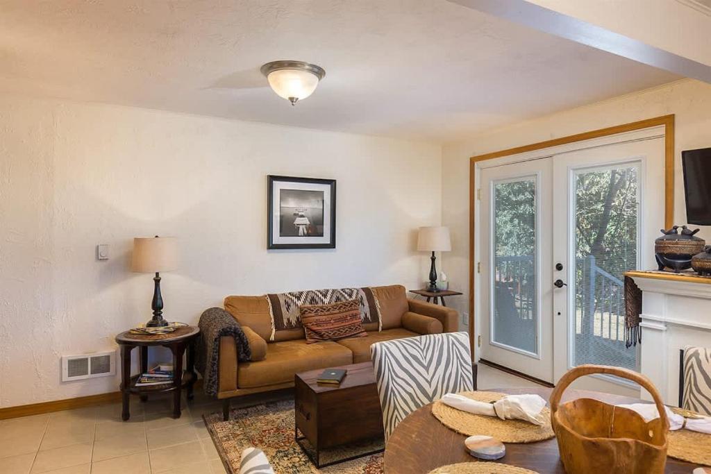 a living room with a couch and a fireplace at SQ Ramblin Rose 3 in Sequim
