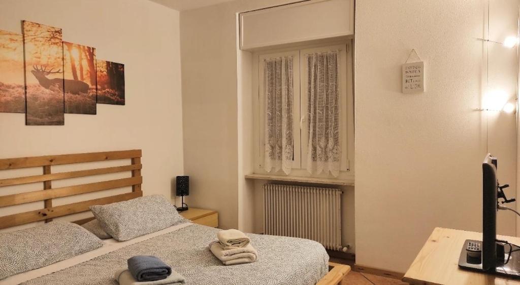 Posteľ alebo postele v izbe v ubytovaní Appartamenti Viola