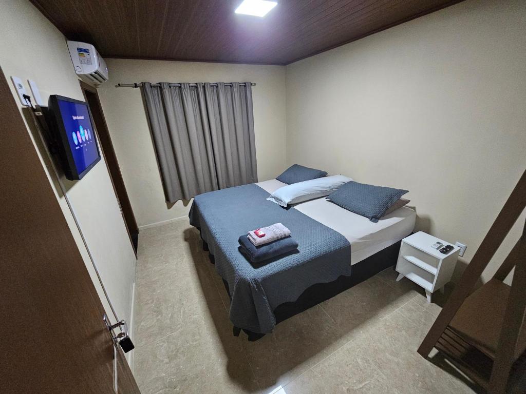 Ένα ή περισσότερα κρεβάτια σε δωμάτιο στο Hospedagem Costa BNU - Q2