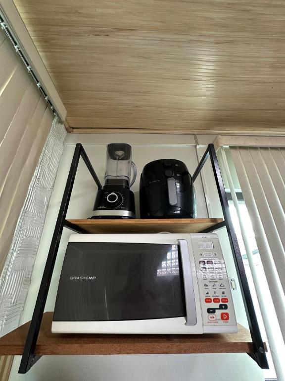 Kuchyň nebo kuchyňský kout v ubytování LOFT Completo - próximo ao Centro com Ar Condicionado