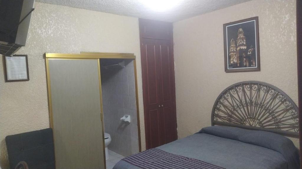 Postel nebo postele na pokoji v ubytování Hotel Palacio