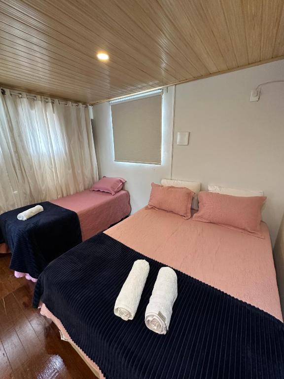 Postel nebo postele na pokoji v ubytování LOFT Completo - próximo ao Centro com Ar Condicionado
