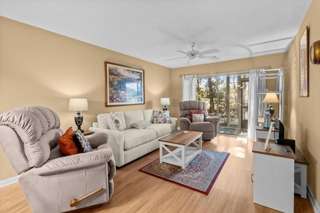 a living room with a couch and two chairs at 2 Bedroom Golf Villa in Pawleys Island in Pawleys Island