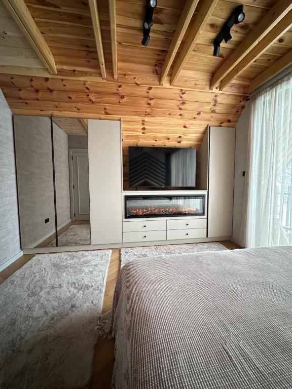 Postel nebo postele na pokoji v ubytování Black Chalet