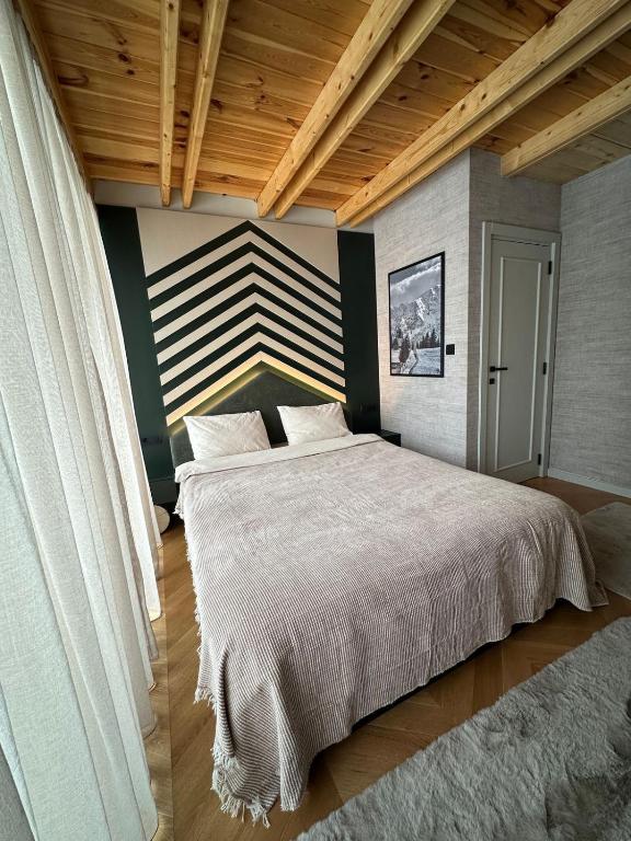 Postel nebo postele na pokoji v ubytování Black Chalet