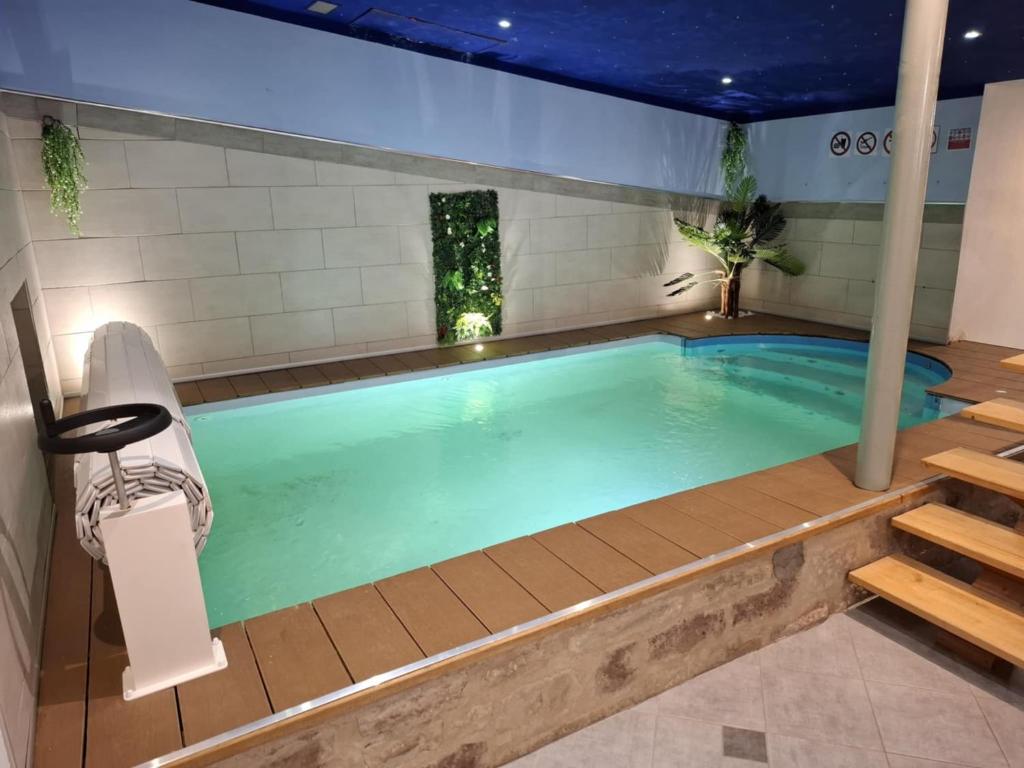 a swimming pool in a building with at Sports et détente in Fresse