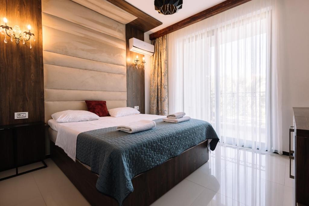 Postel nebo postele na pokoji v ubytování Hotel Platinum Lux