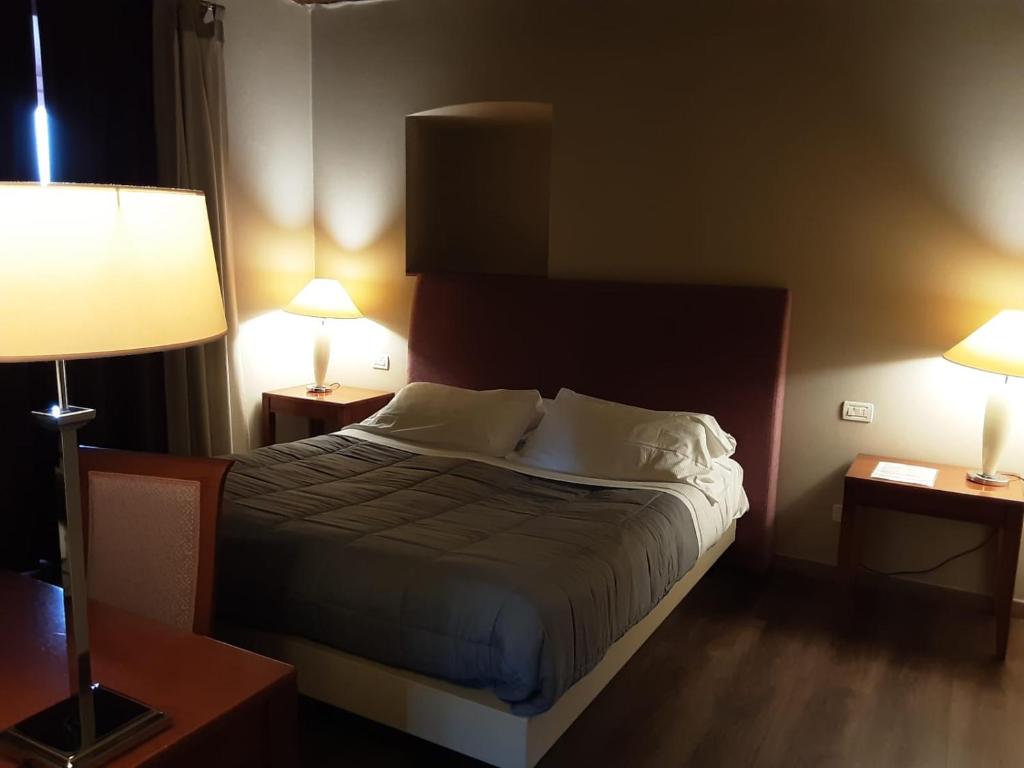 Postel nebo postele na pokoji v ubytování Hotel Antico Podere Propano