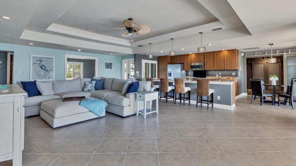 a large living room with a couch and a kitchen at NPL829 in Punta Gorda