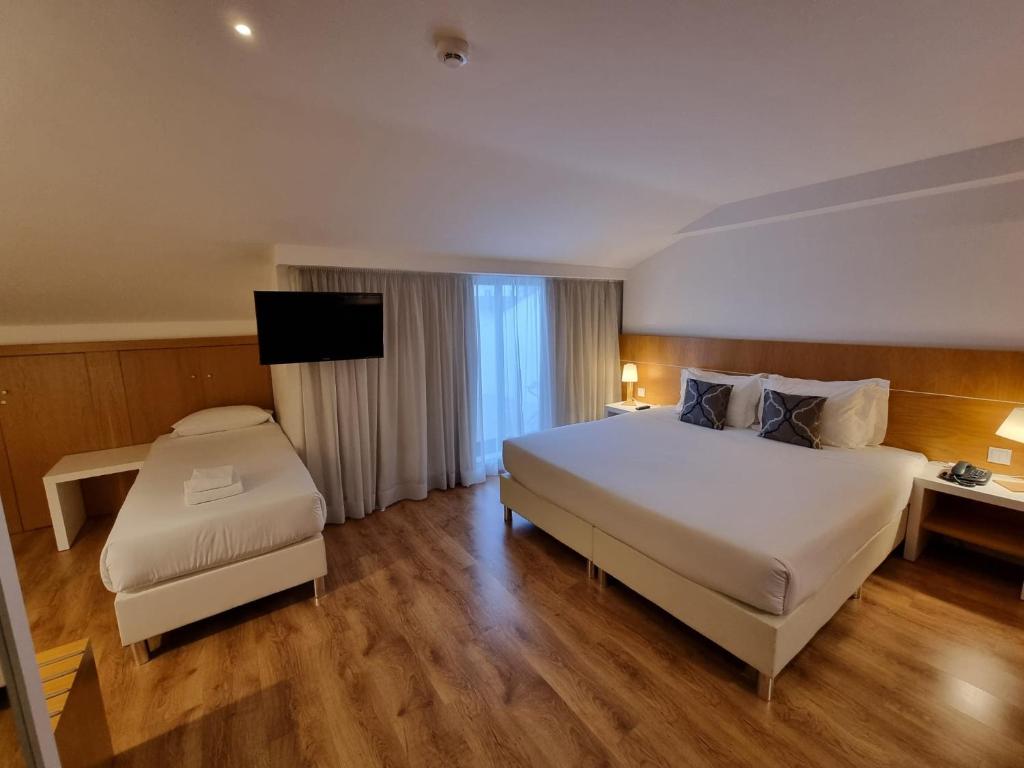 Postel nebo postele na pokoji v ubytování Steyler Fatima Hotel & Congress
