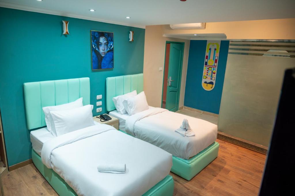 Postel nebo postele na pokoji v ubytování Soft Hotel