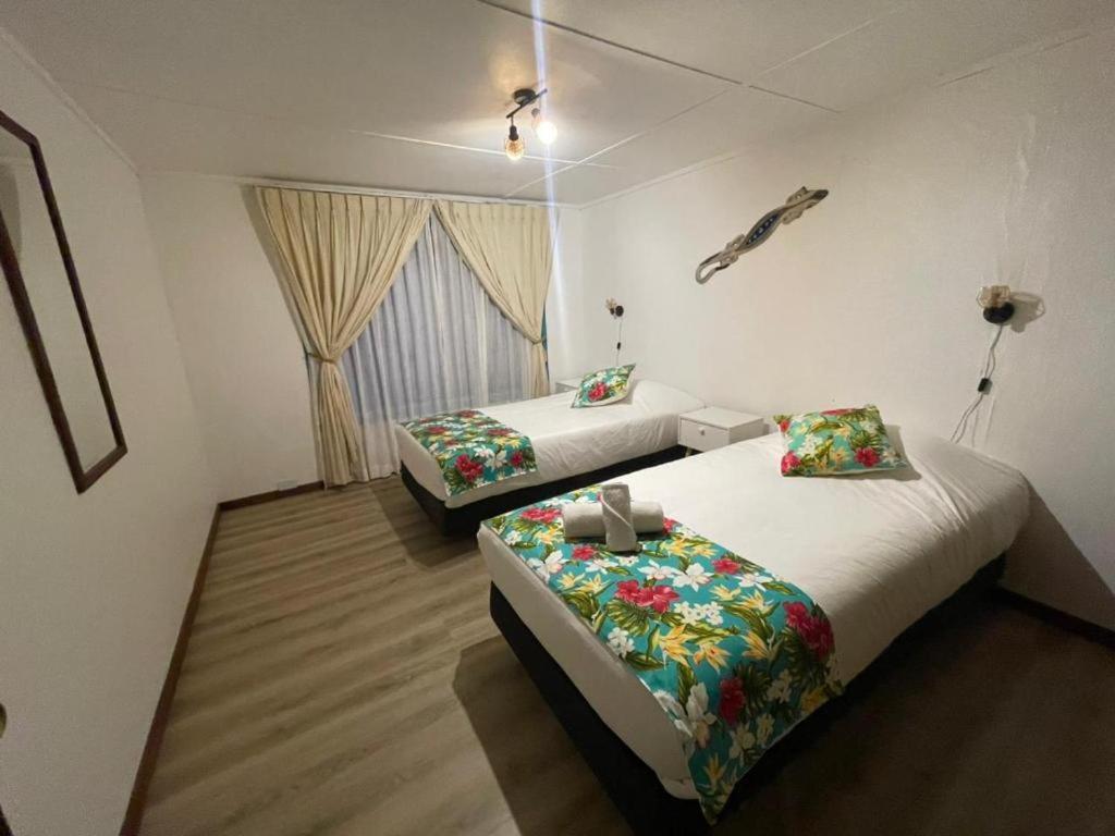 Postel nebo postele na pokoji v ubytování Hotel Hotu Matua by EI