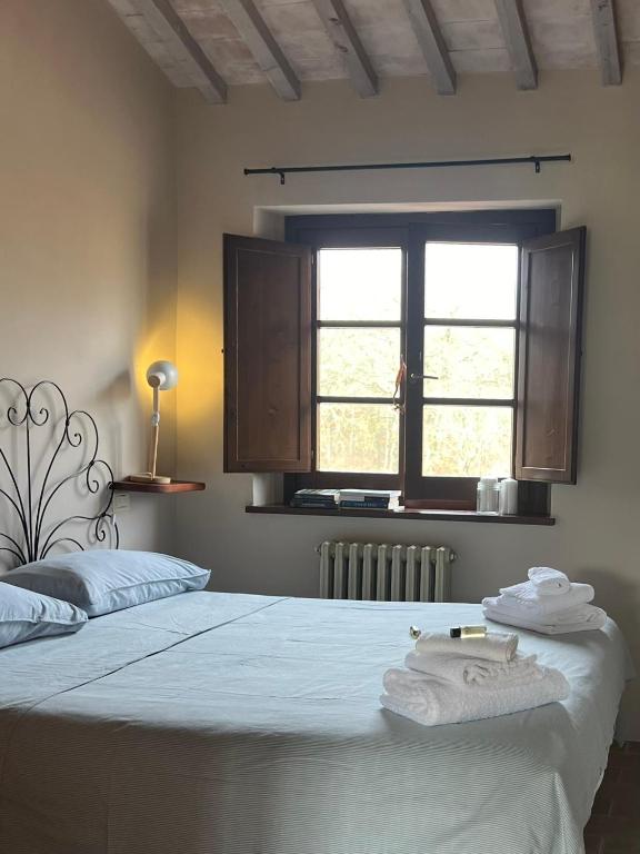 Postel nebo postele na pokoji v ubytování B&B Al Felcino