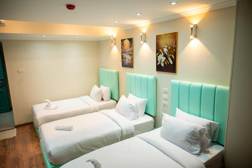 Postel nebo postele na pokoji v ubytování Soft Hotel